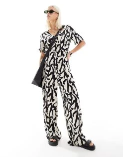 Monki Short Sleeve Jumpsuit With Wrap Front In Bold Mono Abstract Print For Women Multi