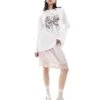 Monki Long Sleeve Relaxed Fit Top With Bow Print In White For Women