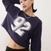 Monki Long Sleeve Cropped T-shirt With '92' Varisty Graphic Print In Navy For Women -Monki Shop 207919766 1 navy