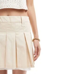 Monki Pleated Mini Skirt With White Layered Raw Hem Detail In Beige For Women -Monki Shop 208134889 4